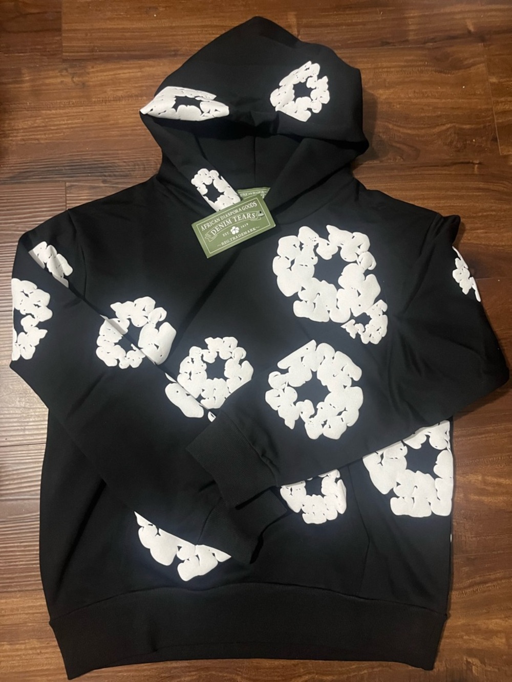 White on black denim tears hoodie.